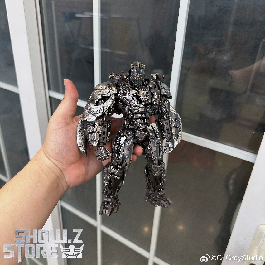 Black robot warrior holding figure detail showing paint application Black robot warrior holding figure detail showing paint application