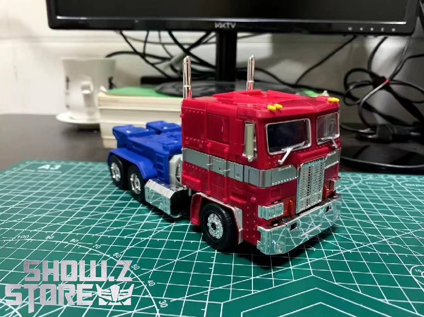 4th Party Optimus Prime KO robot standing armed dual weapons pose 4th Party Optimus Prime KO robot standing armed dual weapons pose