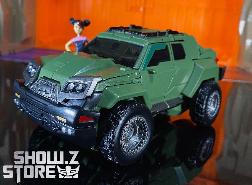 Green vehicle truck mode compact form transformation display Green vehicle truck mode compact form transformation display