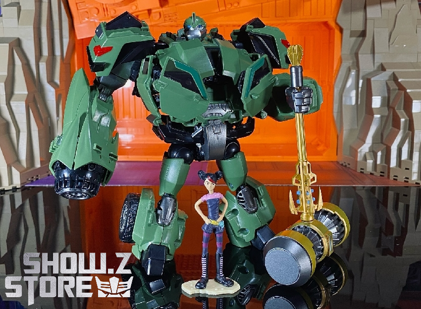 Green robot mid-transformation stance showing limbs and structure Green robot mid-transformation stance showing limbs and structure