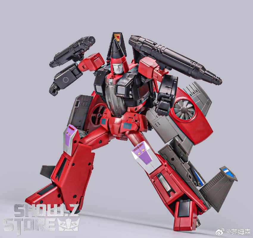 Red black silver robot in standing pose with extended jet wing weapon configurations Red black silver robot in standing pose with extended jet wing weapon configurations