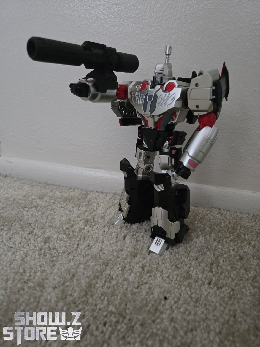 Reformatted Megatron collectible with articulated limbs and cannon accessories displayed Reformatted Megatron collectible with articulated limbs and cannon accessories displayed