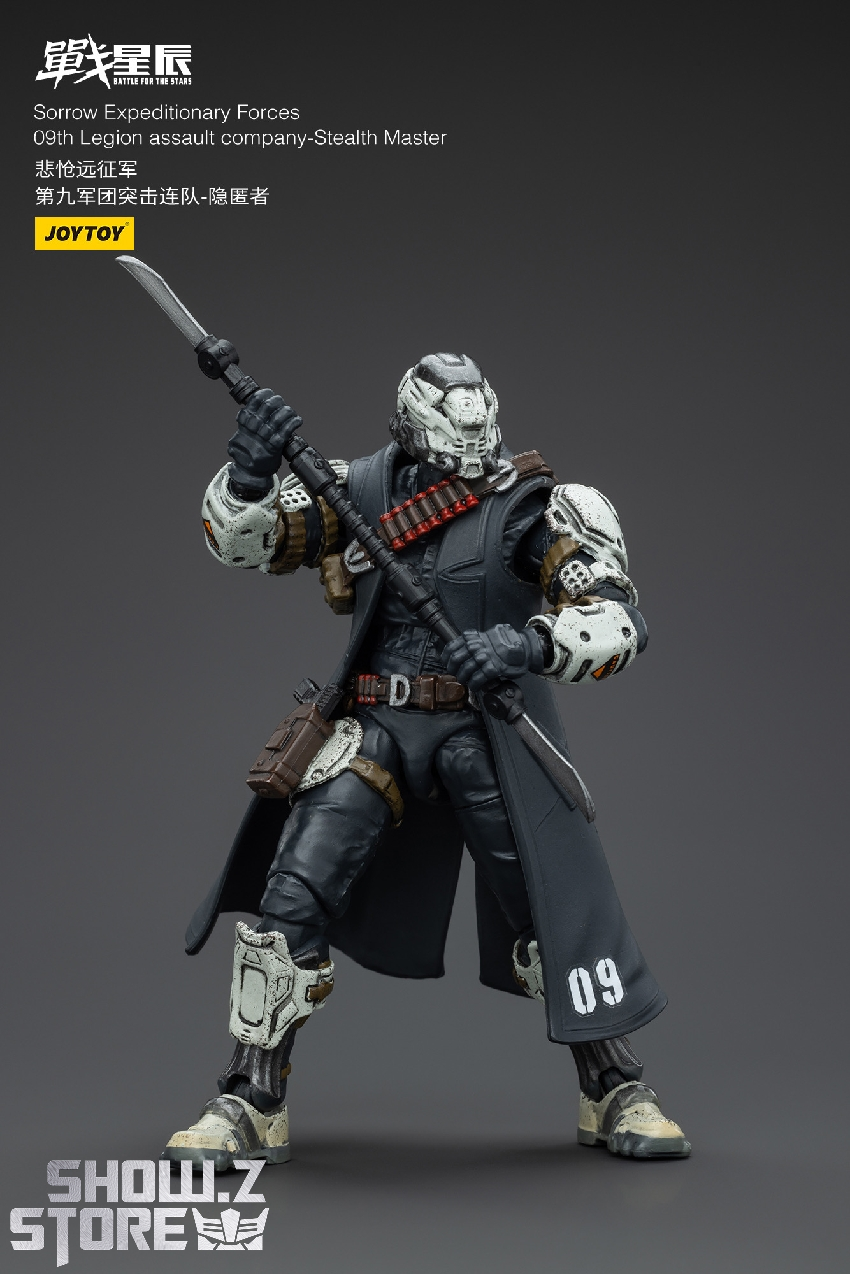 Heavily armed soldier figure with white helmet dark clothing and dual weapons Heavily armed soldier figure with white helmet dark clothing and dual weapons