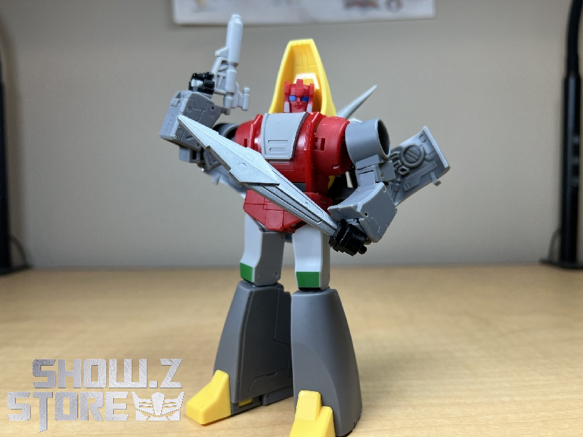 Red and yellow Triceratops dinosaur robot with gray armor plating displayed Red and yellow Triceratops dinosaur robot with gray armor plating displayed