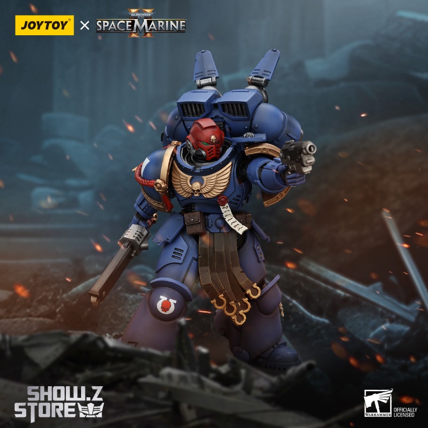 Warhammer 40K warrior blue armor holding heavy weapon Warhammer 40K warrior blue armor holding heavy weapon