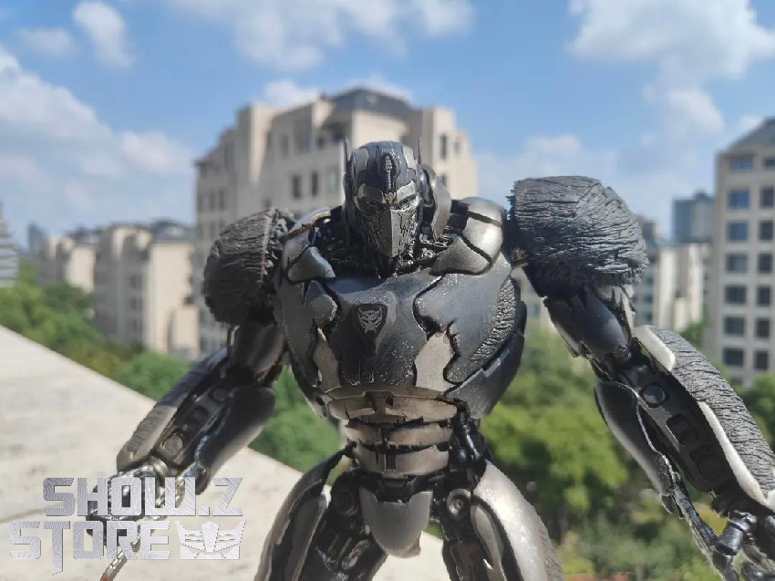 Black Optimus Primal robot in outdoor urban setting showing realistic scale and detail Black Optimus Primal robot in outdoor urban setting showing realistic scale and detail