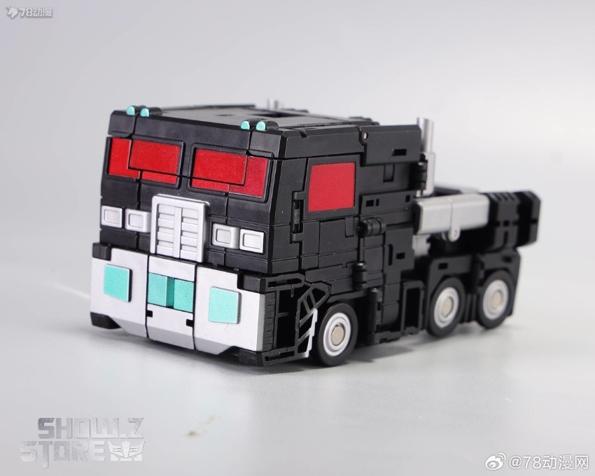Truck mode showing white semi-truck configuration with cyan red accent details Truck mode showing white semi-truck configuration with cyan red accent details