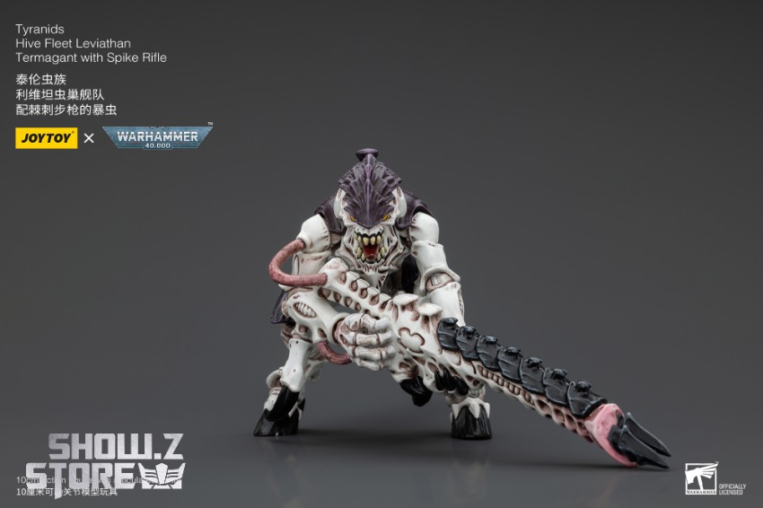 Detailed side-view of JoyToy Warhammer 40K Tyranid spike rifle menacing Detailed side-view of JoyToy Warhammer 40K Tyranid spike rifle menacing