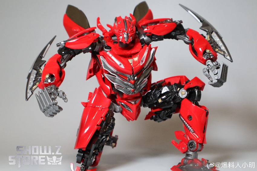 Extended limbs dynamic warrior pose with black metallic accents Extended limbs dynamic warrior pose with black metallic accents