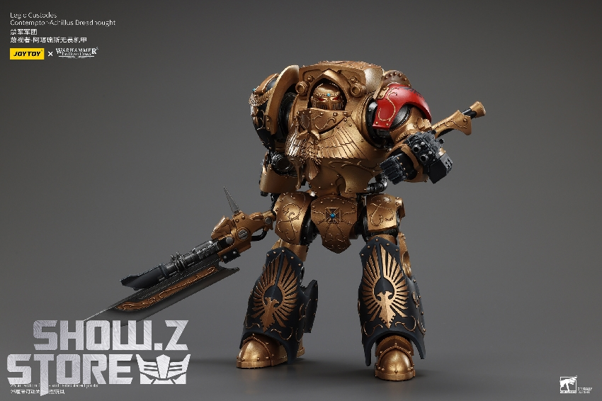 Golden guardian in aggressive stance with red shield and weapon Golden guardian in aggressive stance with red shield and weapon