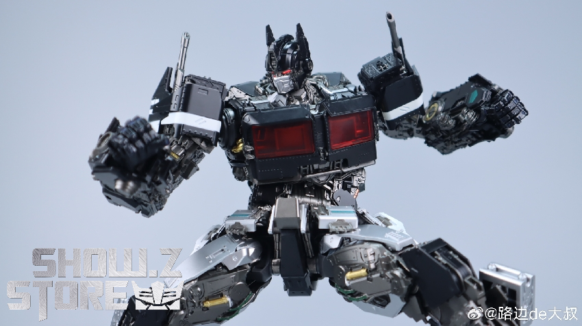 Optimus Prime figure in dynamic action pose with weapons displayed Optimus Prime figure in dynamic action pose with weapons displayed