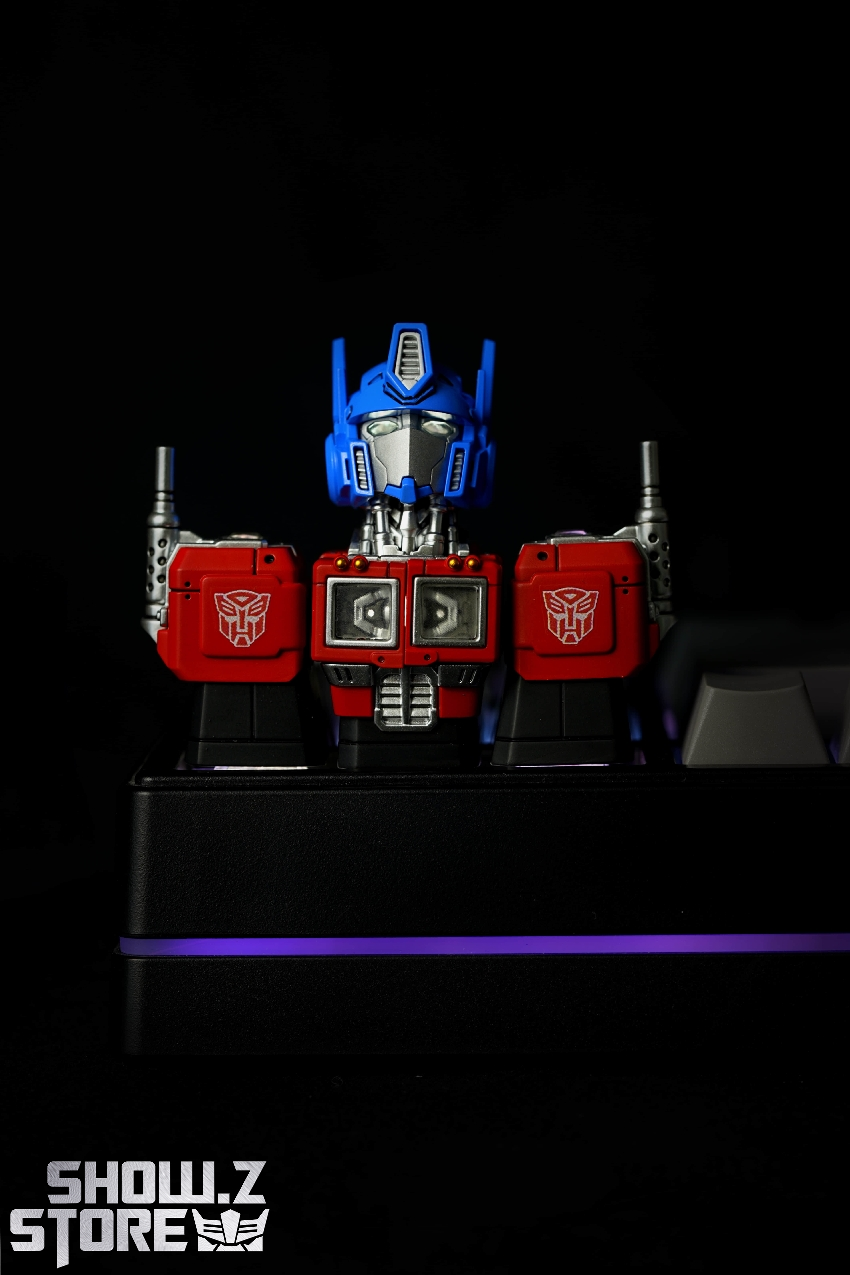 Fully assembled blue red keycap robot illuminated purple base stand Fully assembled blue red keycap robot illuminated purple base stand