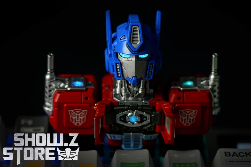 Blue red Optimus Prime keycap robot figure standing upright keyboard base Blue red Optimus Prime keycap robot figure standing upright keyboard base