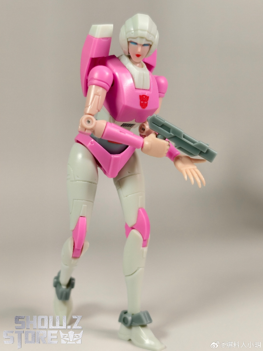 Pink white female robot character with weapon accessory Pink white female robot character with weapon accessory