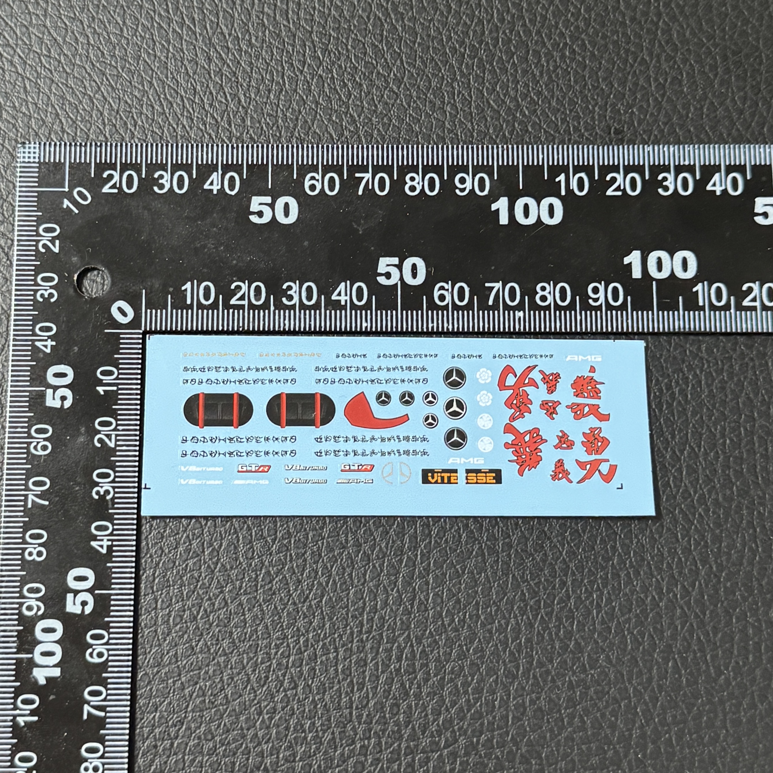 Detailed decal sheet displaying transformation armor components Detailed decal sheet displaying transformation armor components