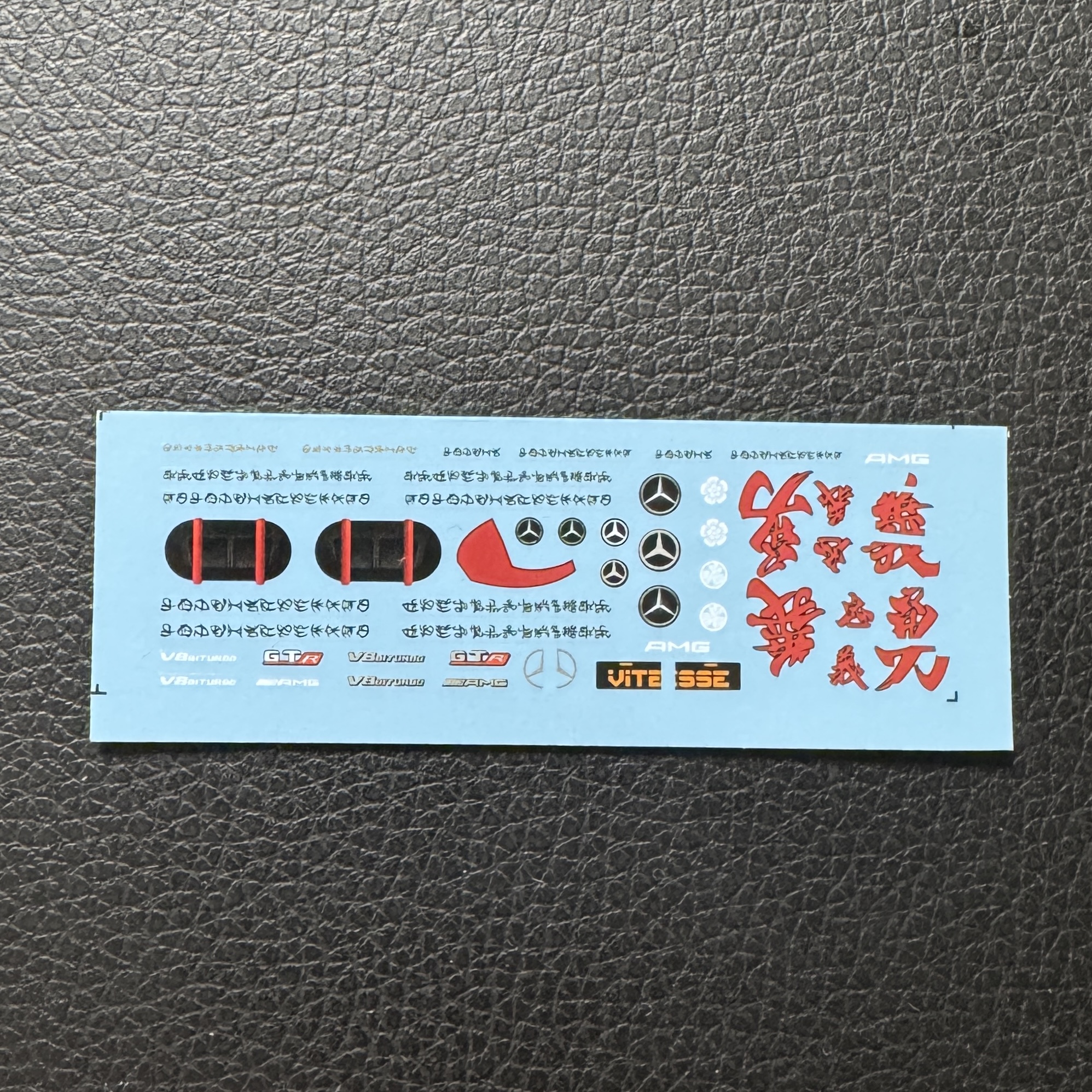Metallic black sports car Drift showing red accent stickers Metallic black sports car Drift showing red accent stickers