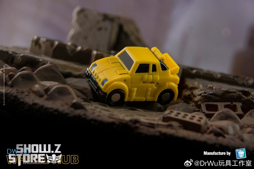 Yellow vehicle form compact car mode transforming figure Yellow vehicle form compact car mode transforming figure