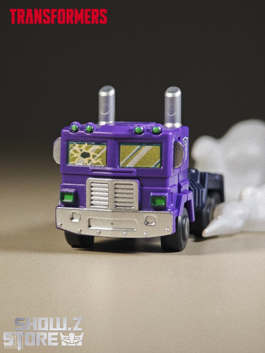 Purple white Transformers vehicle mode dual smokestacks shown Purple white Transformers vehicle mode dual smokestacks shown