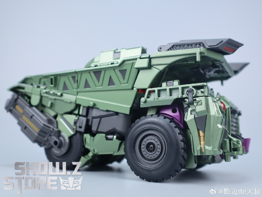 Long Haul robot holding weapon with complete green purple color scheme Long Haul robot holding weapon with complete green purple color scheme