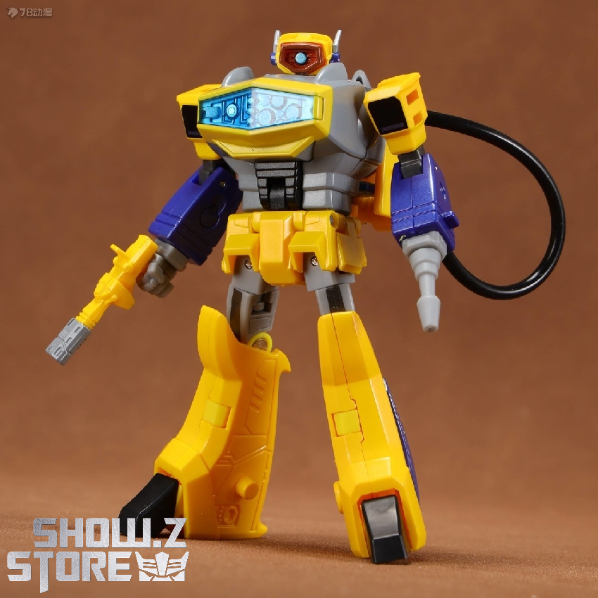Shattered Glass variant transformer displaying yellow armor blue mechanical Shattered Glass variant transformer displaying yellow armor blue mechanical