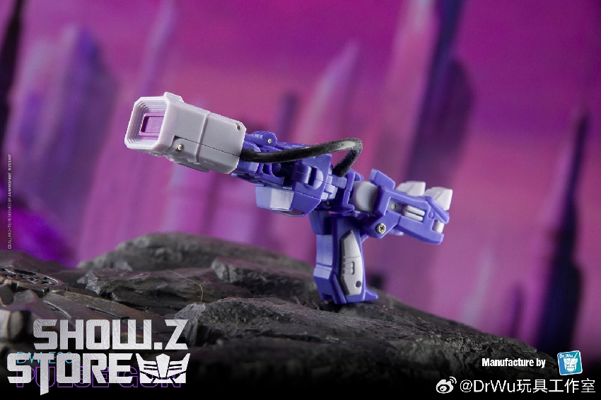 DW-E38 red black robot figure striking dynamic pose rocky terrain DW-E38 red black robot figure striking dynamic pose rocky terrain