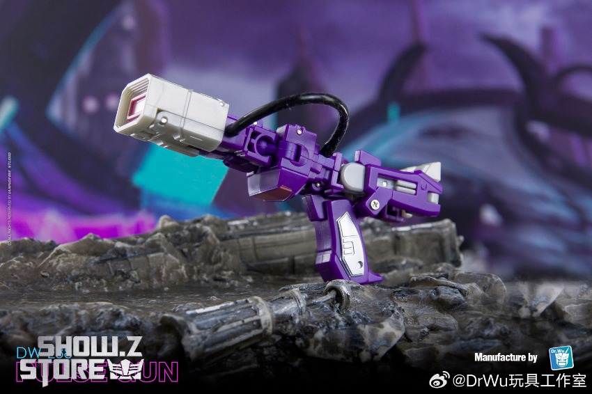 Blue robot with intricate purple pink mechanical parts display Blue robot with intricate purple pink mechanical parts display