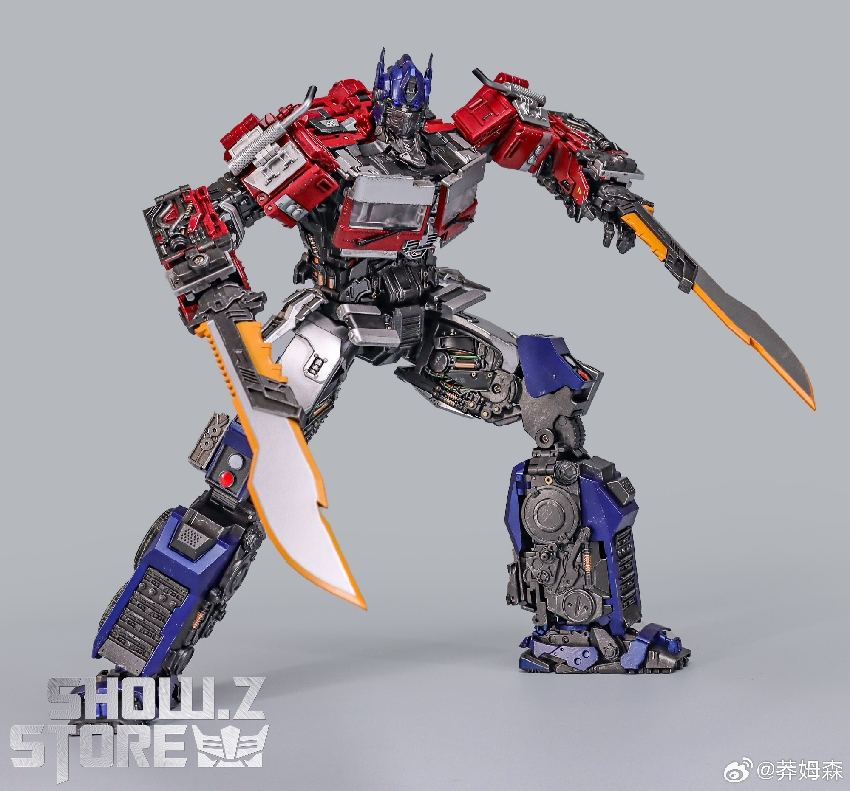 Red and white Obowu transformer character in combat action stance Red and white Obowu transformer character in combat action stance