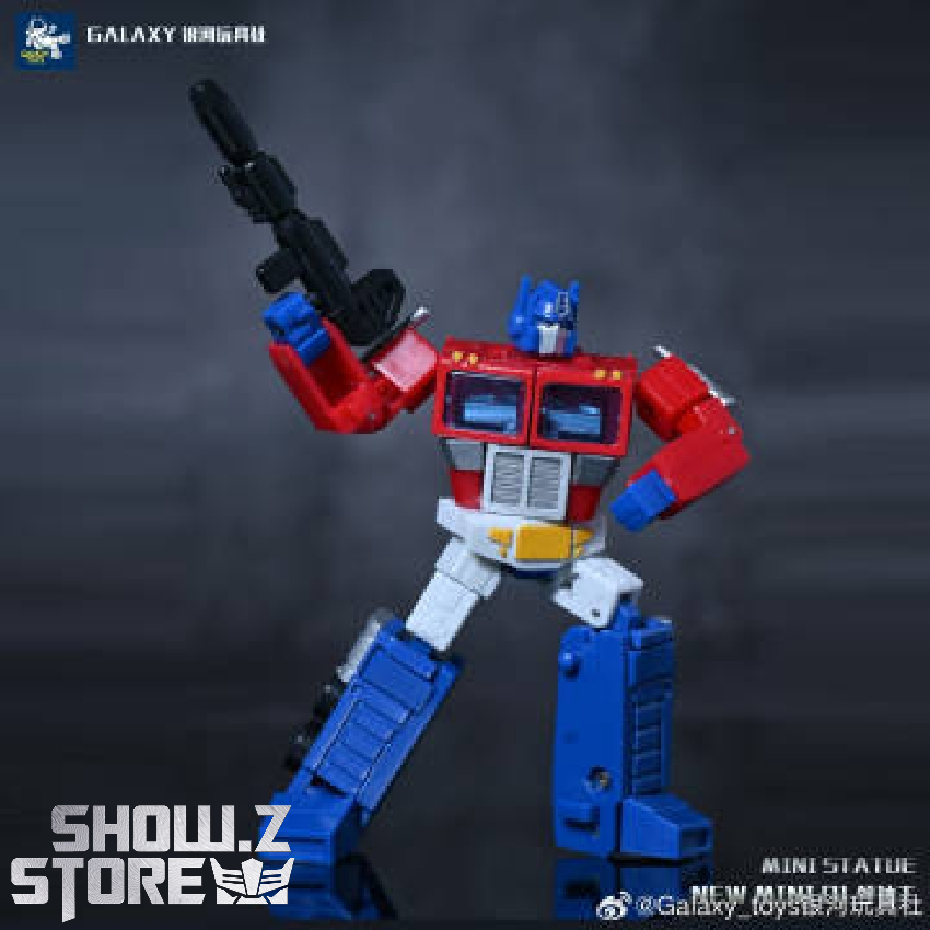 Optimus Prime figure raised fist pose with black cannon weapon Optimus Prime figure raised fist pose with black cannon weapon