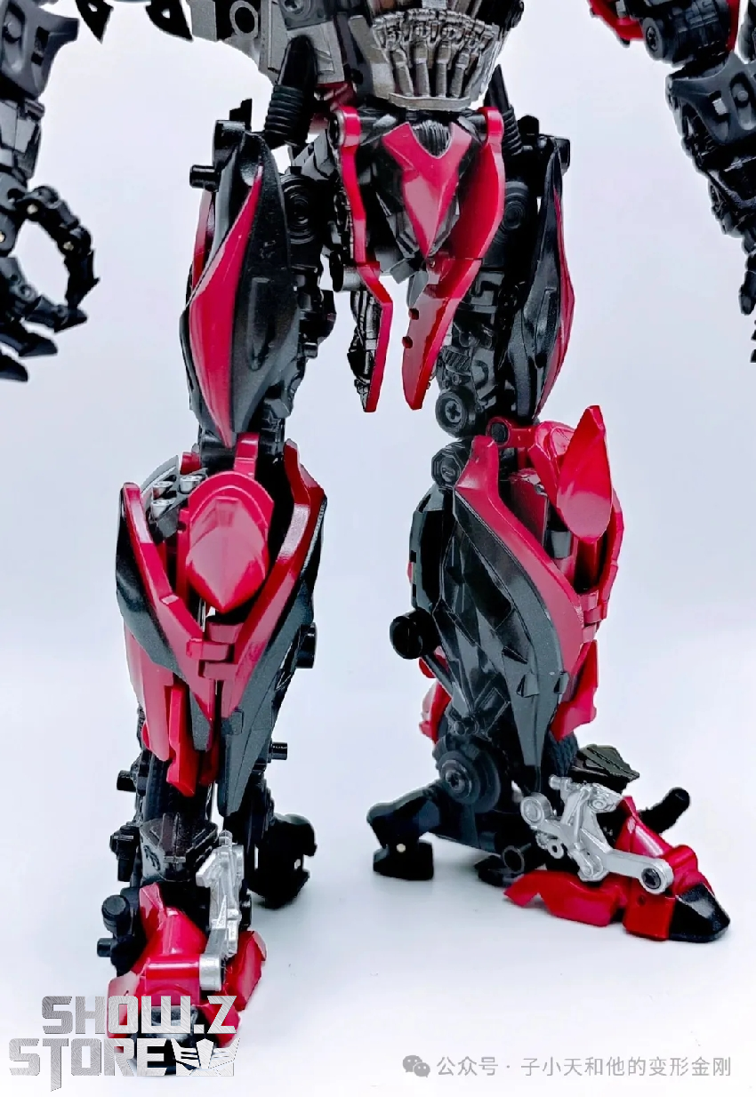 Stinger transformer warrior figure with menacing stance and blade weapon extended Stinger transformer warrior figure with menacing stance and blade weapon extended