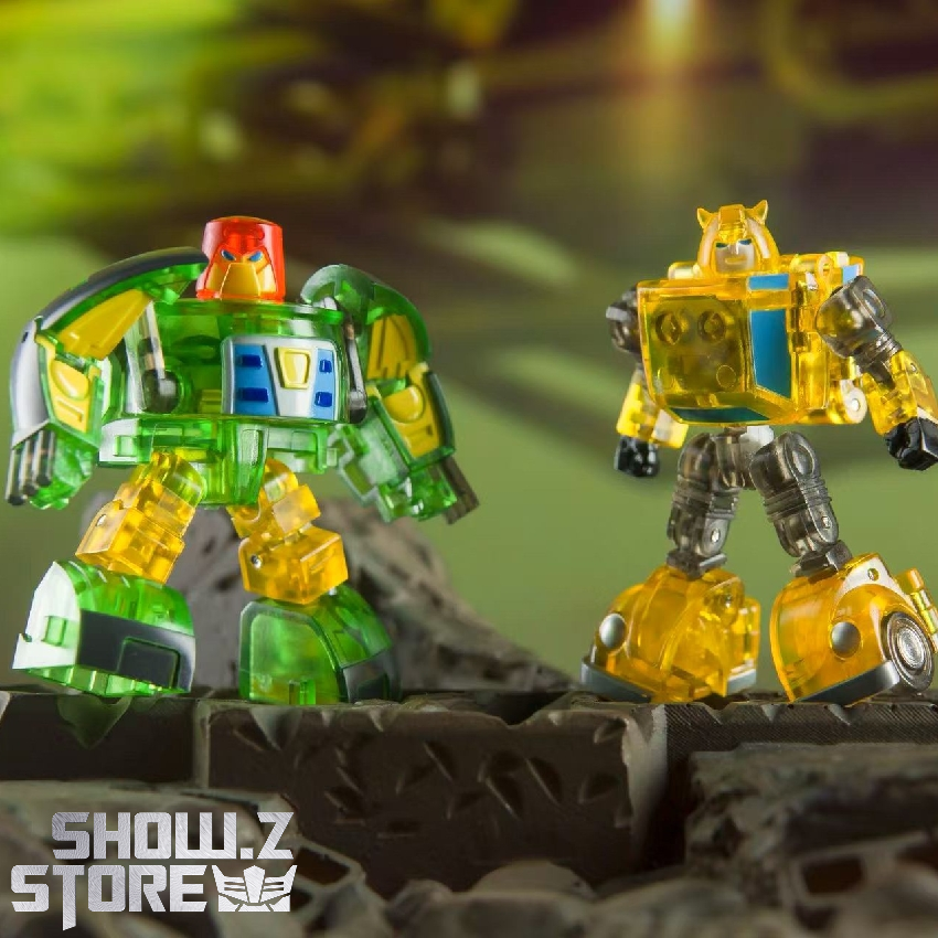 Yellow and green transparent toy robots displayed side by side Yellow and green transparent toy robots displayed side by side