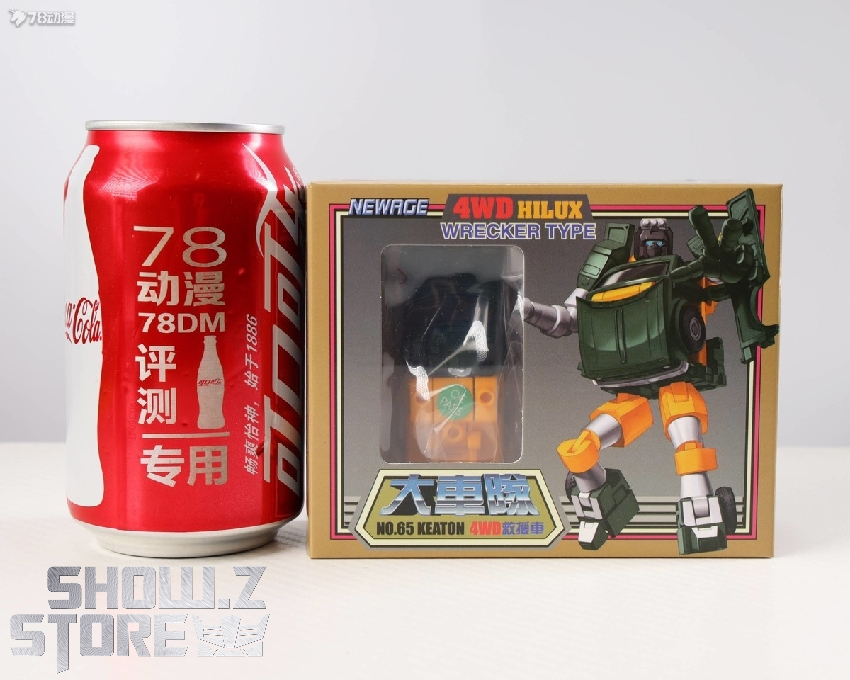 Transformers action figure with orange and black color scheme in retail box Transformers action figure with orange and black color scheme in retail box