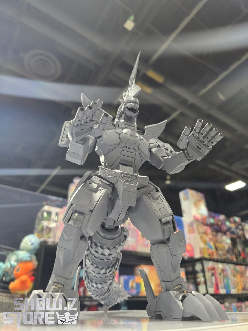 Front facing black and gray Dragonzord toy with prominent weapon attachments Front facing black and gray Dragonzord toy with prominent weapon attachments