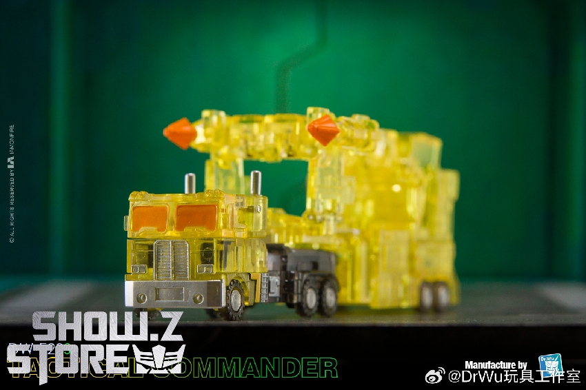 Transparent yellow truck-mode robot from multiple display angles Transparent yellow truck-mode robot from multiple display angles