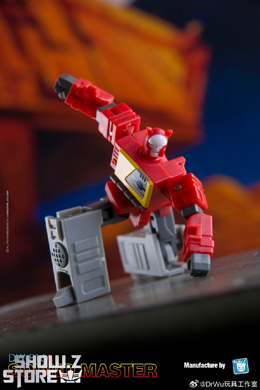 Red Soundwave robot with small purple and yellow cassette companions Red Soundwave robot with small purple and yellow cassette companions