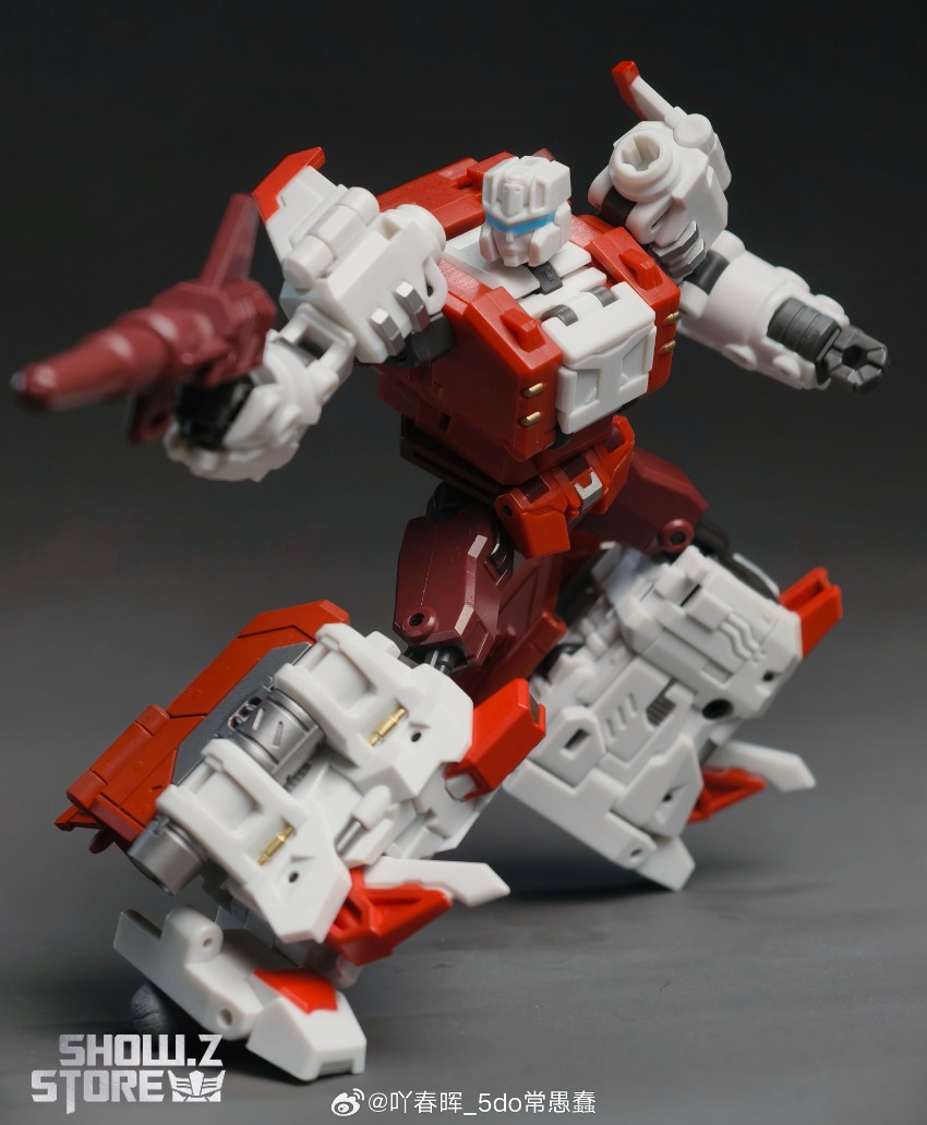 Red robot figure with extended limbs in mid-action combat pose accessories Red robot figure with extended limbs in mid-action combat pose accessories
