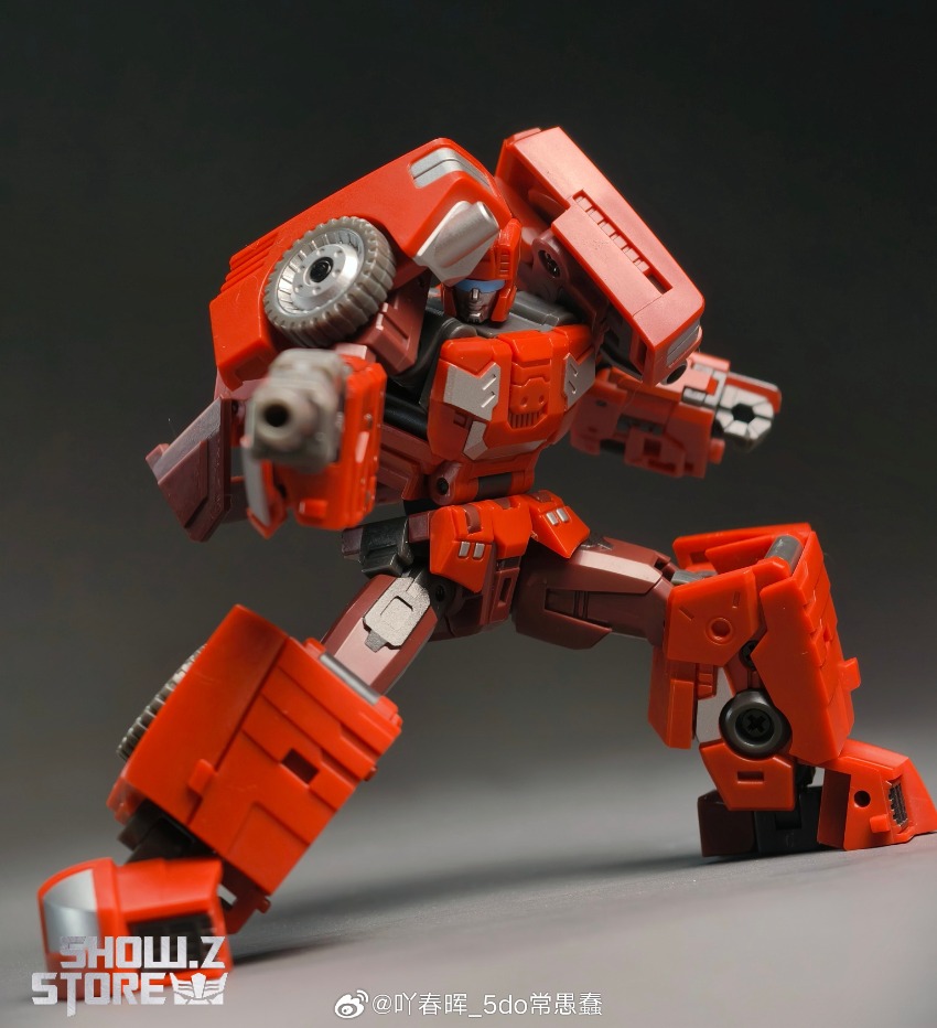 Red robot with large weapon system in aggressive attacking stance motion Red robot with large weapon system in aggressive attacking stance motion
