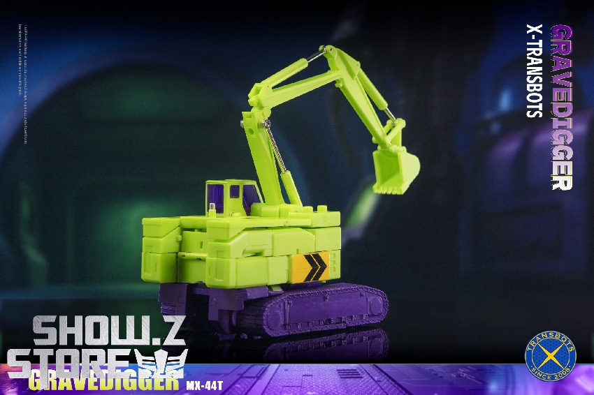 Yellow-green and purple construction vehicle robot standing upright Yellow-green and purple construction vehicle robot standing upright