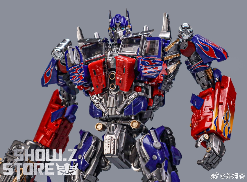 Transformers red blue robot standing with arms extended robot form Transformers red blue robot standing with arms extended robot form