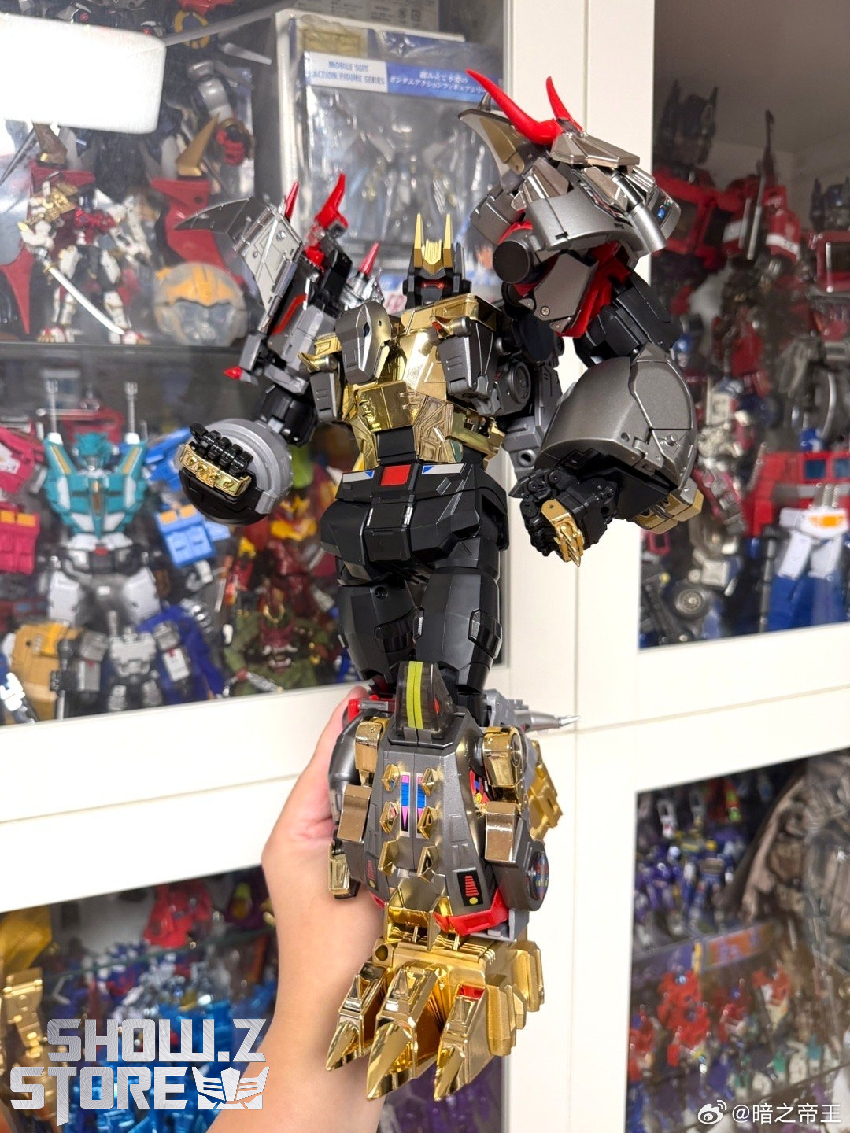 Hand-held yellow and black robot figure with detailed armor Hand-held yellow and black robot figure with detailed armor
