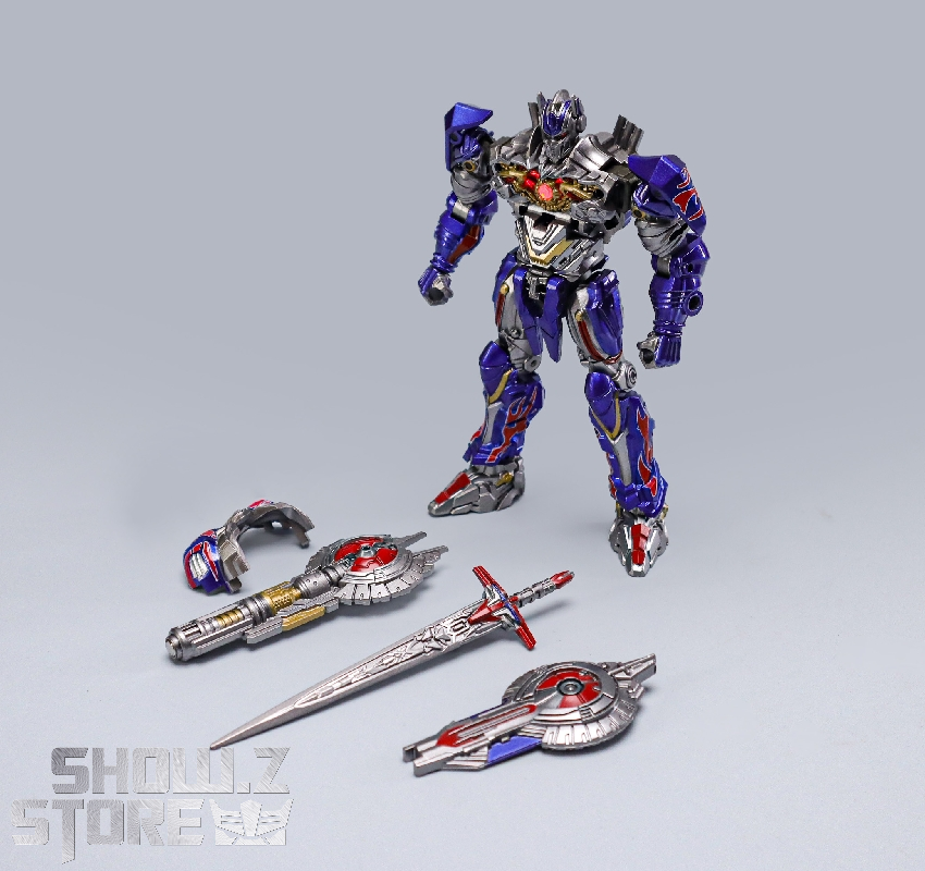 Blue and gold robot warrior in heroic standing pose with weapon Blue and gold robot warrior in heroic standing pose with weapon