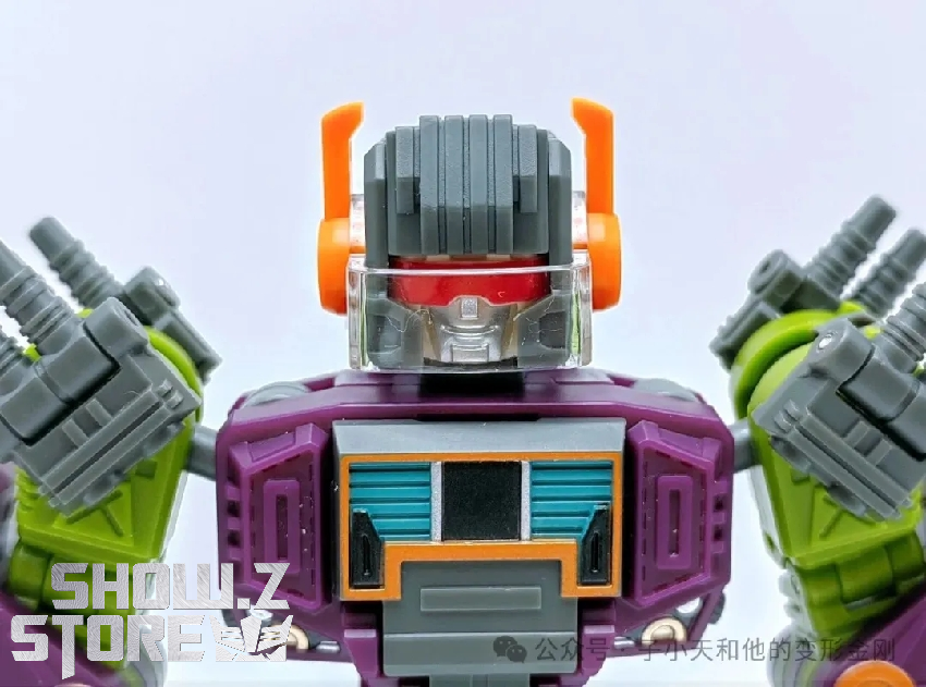 Robot in robot mode displaying orange wings purple armor plating Robot in robot mode displaying orange wings purple armor plating