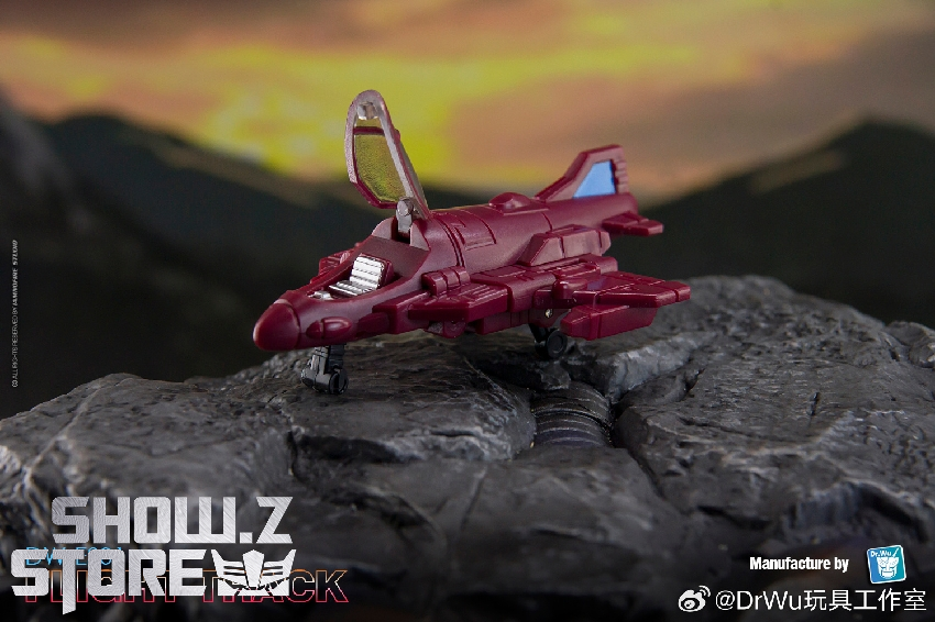 Magenta truck on rocky ground displaying front quarter view mountainous terrain Magenta truck on rocky ground displaying front quarter view mountainous terrain