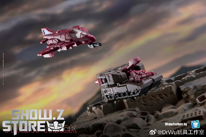 Maroon transformer vehicle in flight pose against dramatic sunset mountain landscape Maroon transformer vehicle in flight pose against dramatic sunset mountain landscape