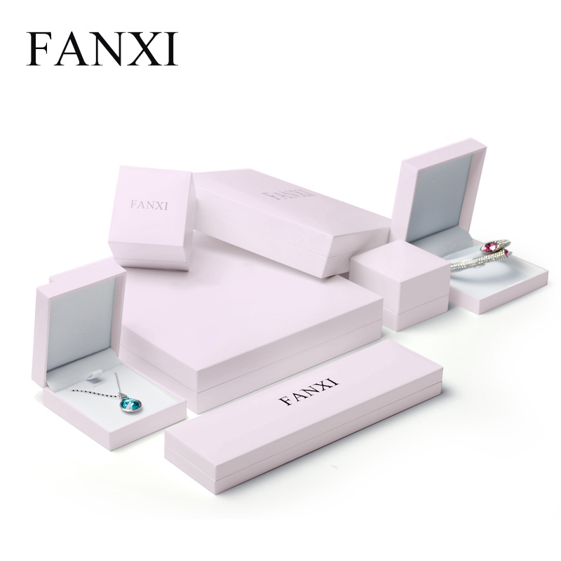 Pink jewelry packaging box with white velvet inside