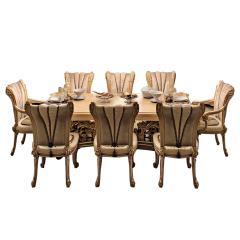 Baroque-style heavily carved dining table creates a distinguished dining experience