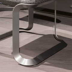 Stainless steel feet in nickel brushed chair