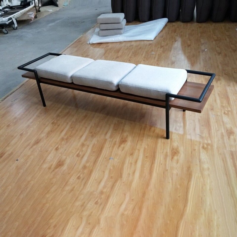 Matel in matt black match with MDF plywood veneered in walnut bed stool