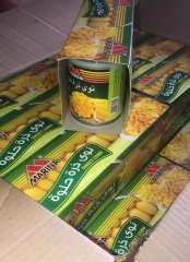 canned sweet corn with spoon & cover