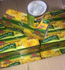 canned sweet corn with spoon & cover