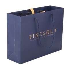 Ivory paper gold foiled logo clothes shopping blue paper bag with ribbon closure in the middle,Shopping Paper Bag,Appareal  Paper Bag
